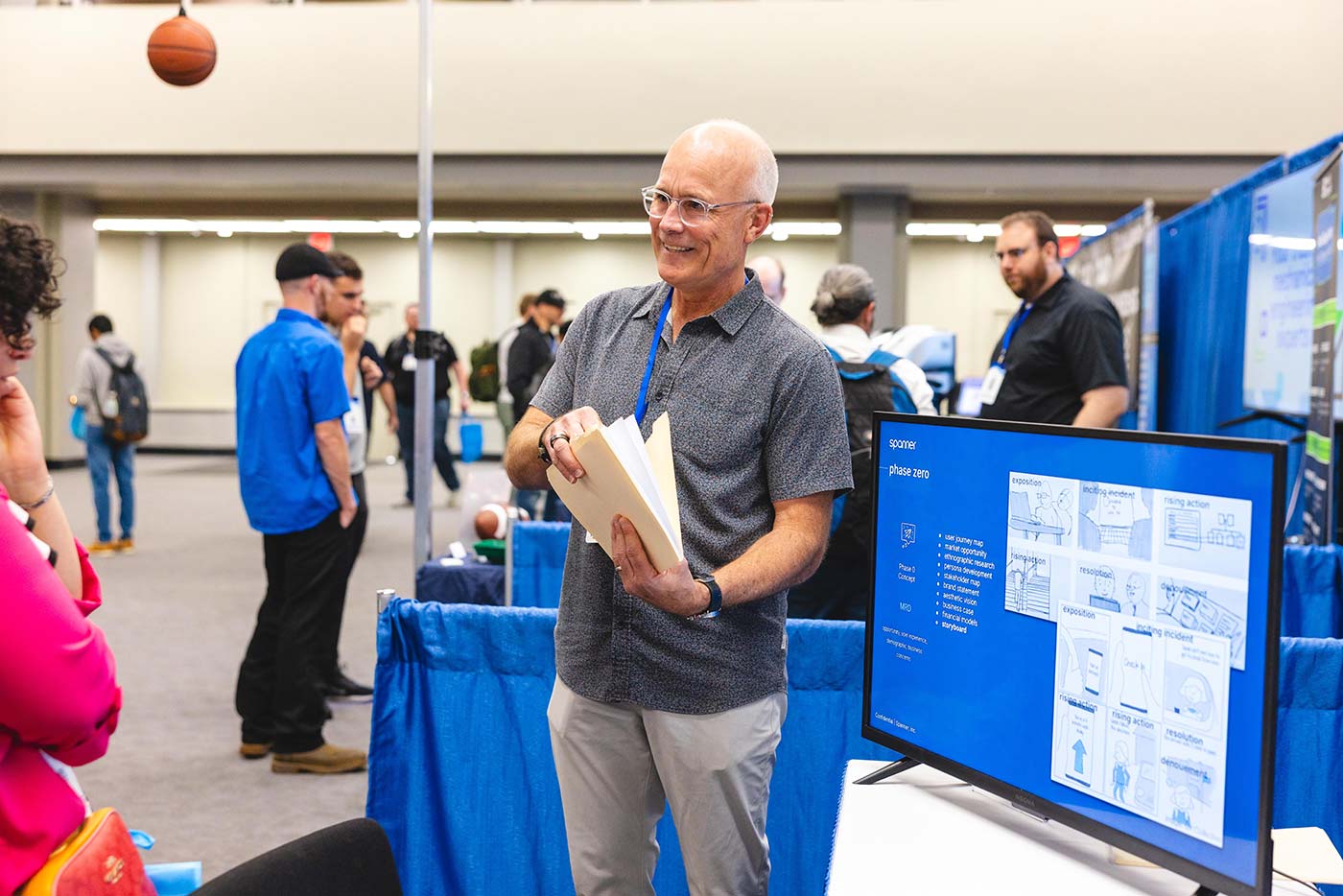 An exhibitor explaining a product development process